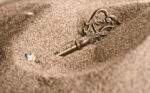 Key in the sand scaled