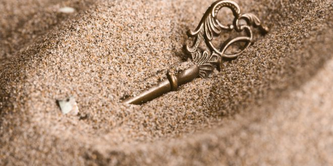 Key in the sand scaled