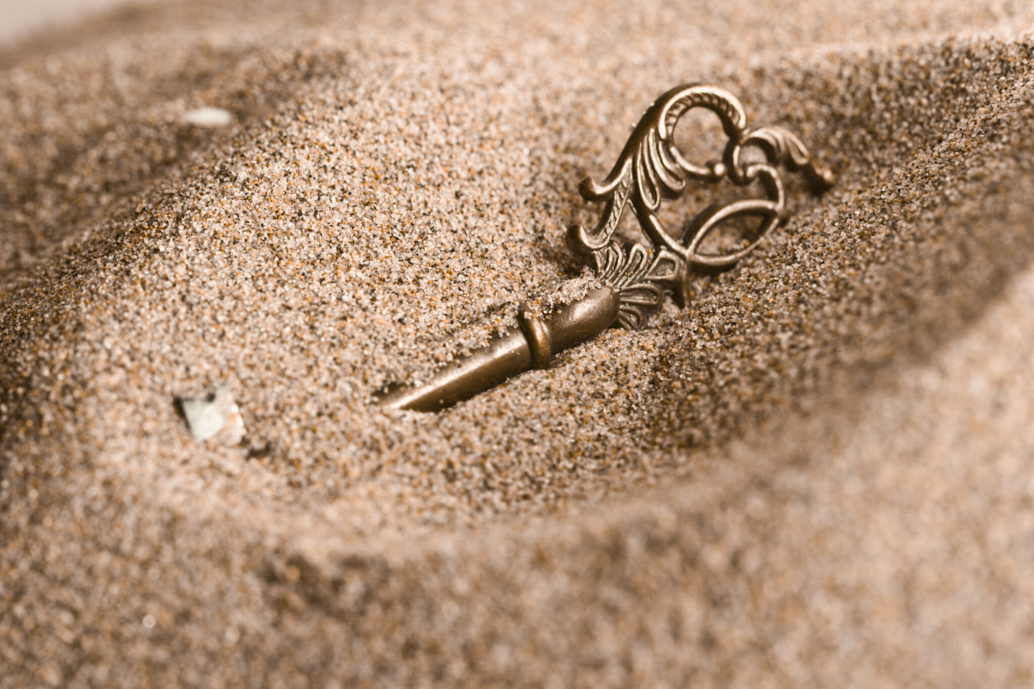 Key in the sand scaled