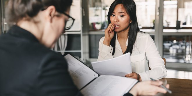 Nervous businesswoman scaled